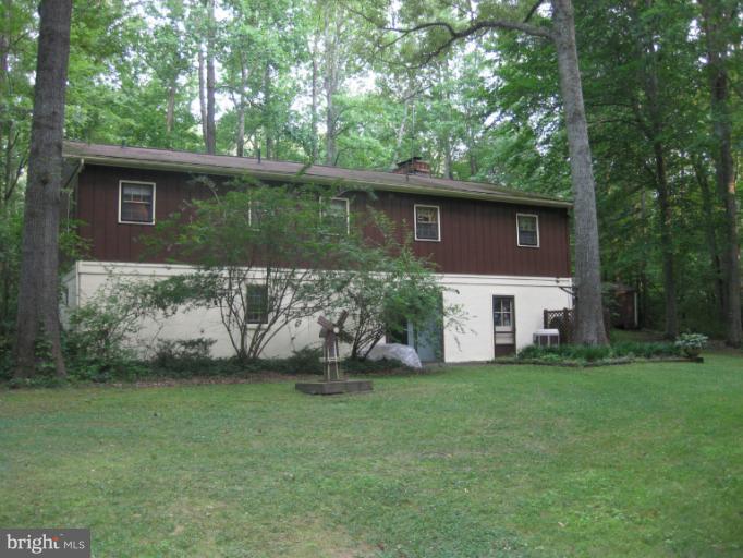 1980 Plum Point Road Huntingtown, MD 20639 - Photo 19 of 27 a view of a house with a yard