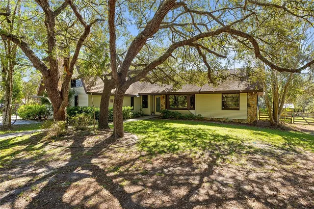 front view of a house with a trees