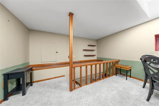 a spacious bedroom with a bed dresser and window