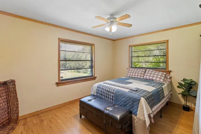 a view of a house with backyard porch and sitting area