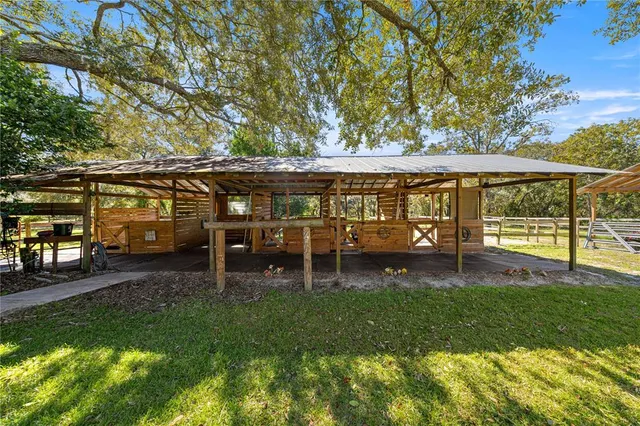 a view of a house with a yard porch and sitting area