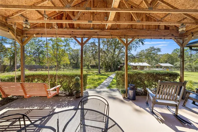 a view of outdoor space with deck and yard