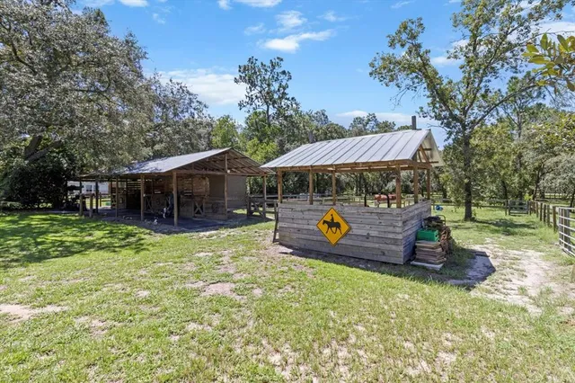 a view of a house with a back yard