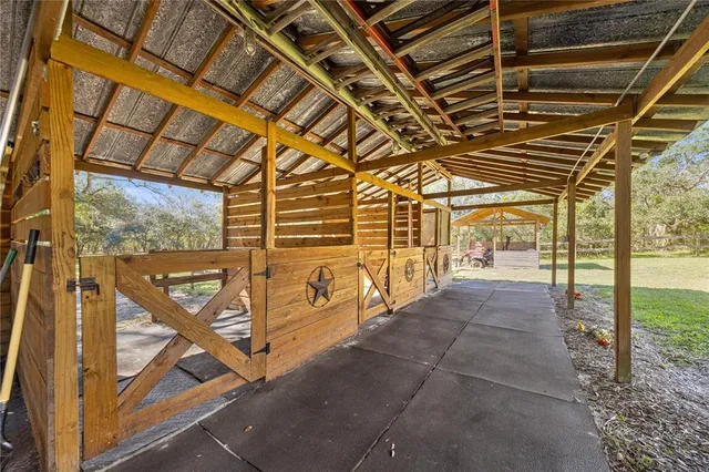 a view of a garage with wooden floor