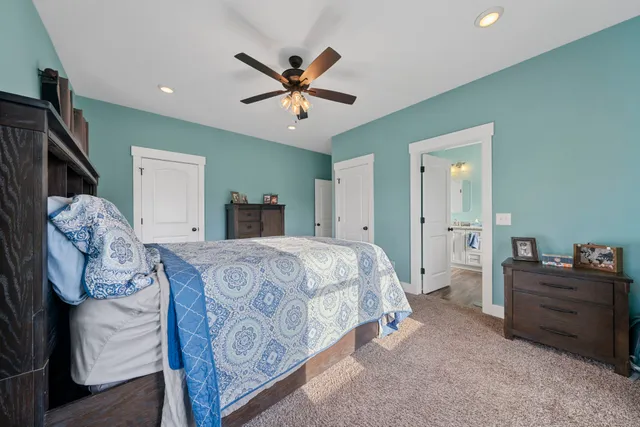 a living room with furniture and a book shelf