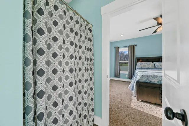 a view of a livingroom with furniture and a flat screen tv