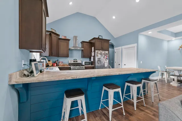 a kitchen with a sink cabinets and window