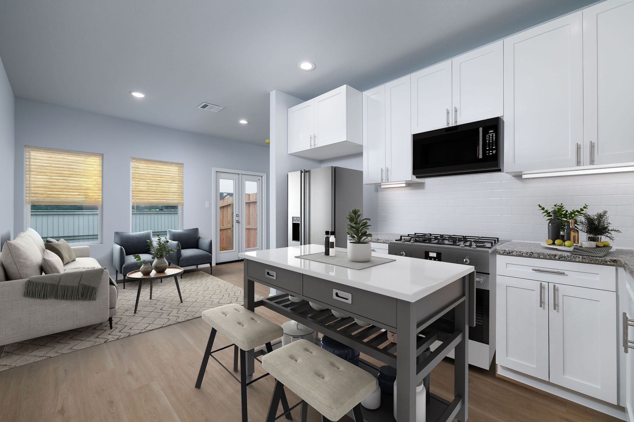 18834 Elegance Ave Spring Spring, TX 77379 - Photo 5 of 19 a living room with stainless steel appliances granite countertop furniture a fireplace a flat screen tv and a window