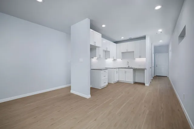 a view of kitchen with wooden floor