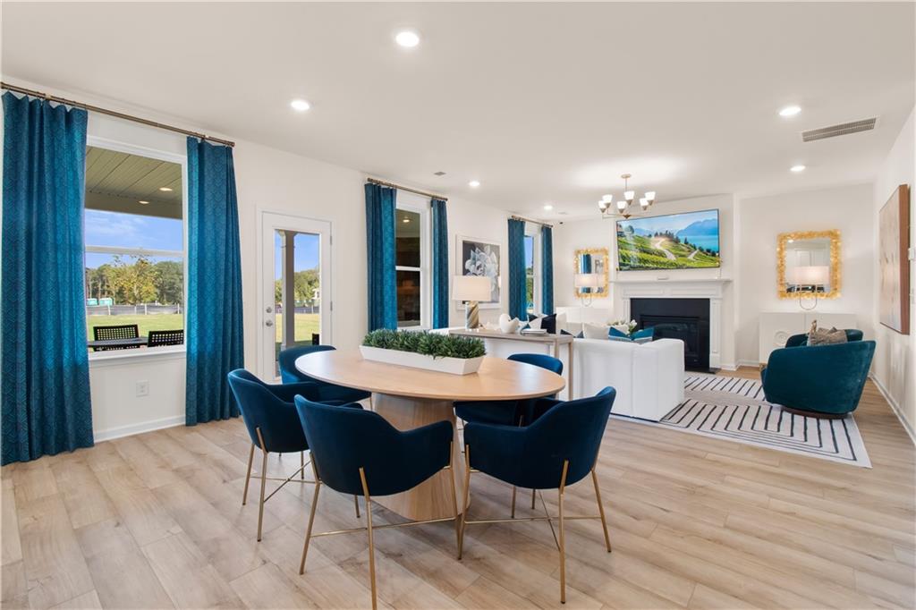 295 Abbotts Xing Circle Covington, GA 30016 - Photo 19 of 34 a view of a livingroom with furniture and a fireplace