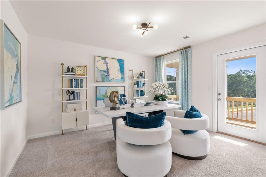295 Abbotts Xing Circle Covington, GA 30016 - Photo 24 of 34 a living room with furniture and decor