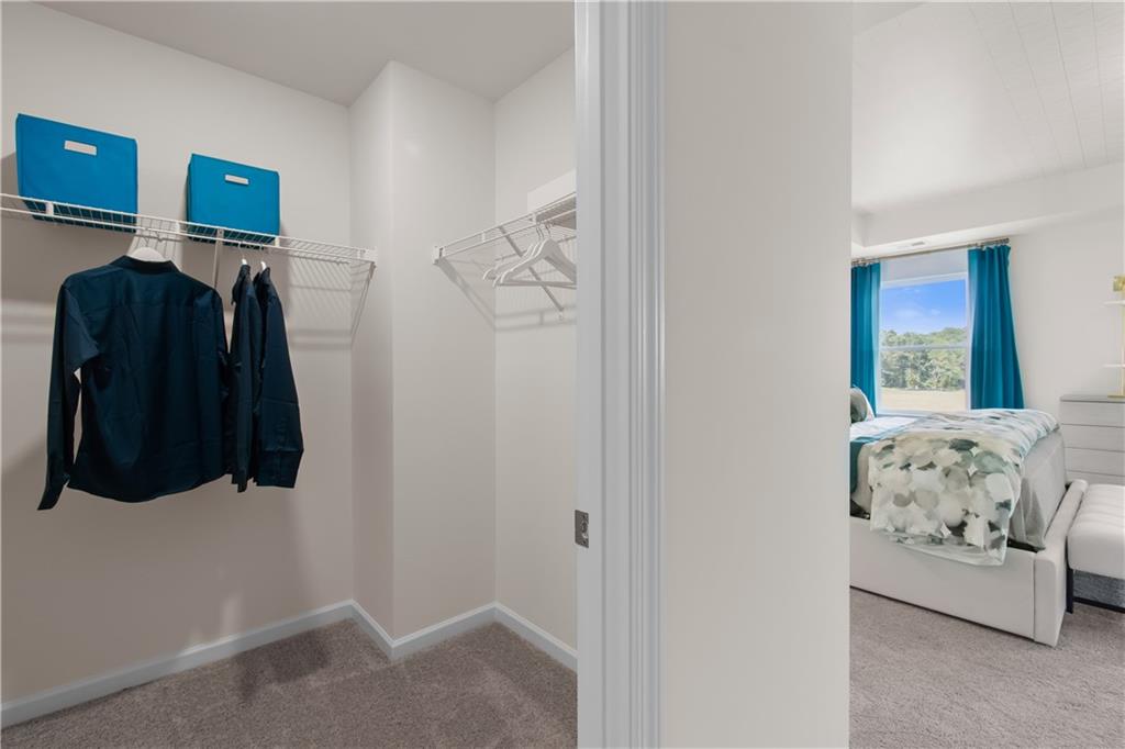 295 Abbotts Xing Circle Covington, GA 30016 - Photo 28 of 34 a bedroom with a bed and a window