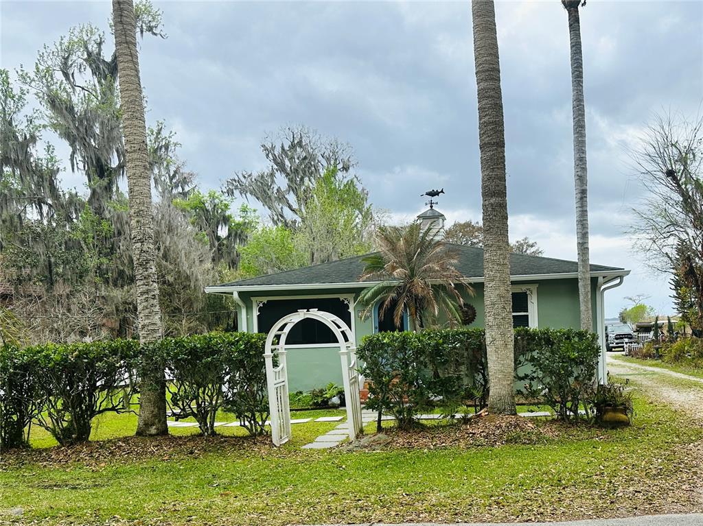 357 Magnolia Place DeBary, FL 32713 - Photo 2 of 50 a front view of a house with garden