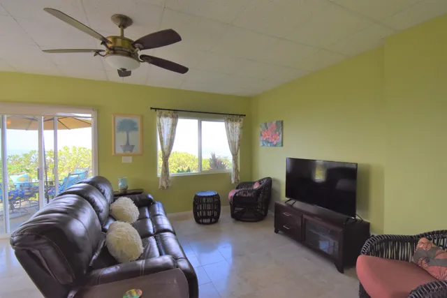 a bedroom with a bed and a table chair