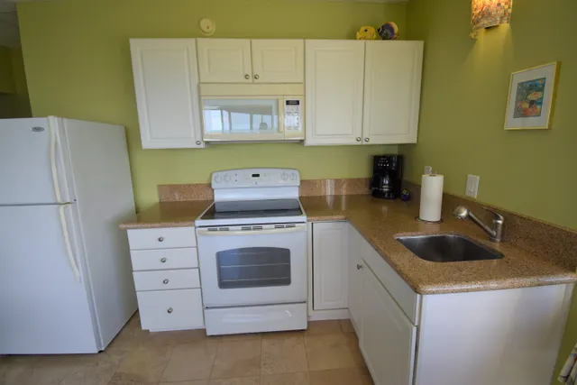 a view of house with garden space and swimming pool