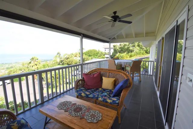 a view of a patio with a table chairs and a table
