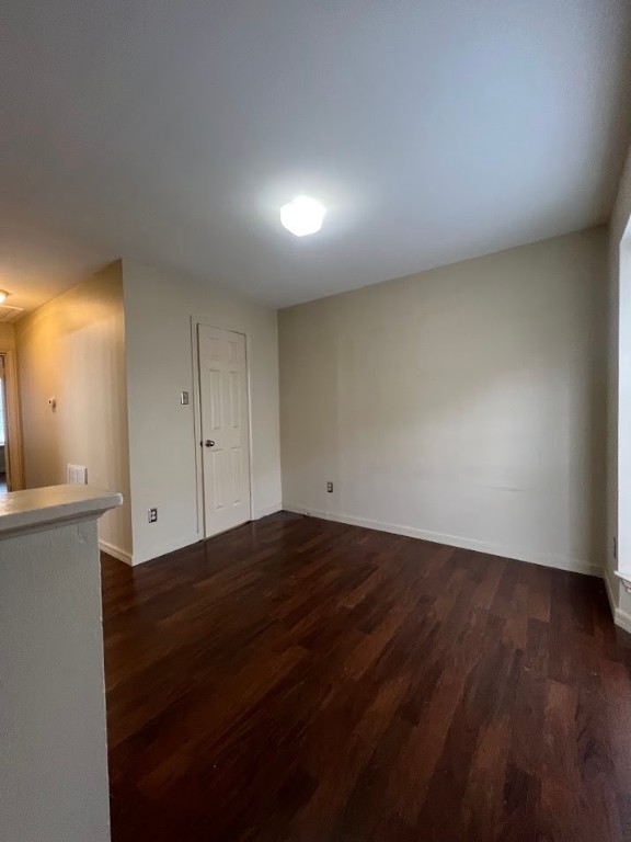 2529 Rio Grande Street, Unit 31 Austin, TX 78705 - Photo 11 of 21 an empty room with wooden floor and windows