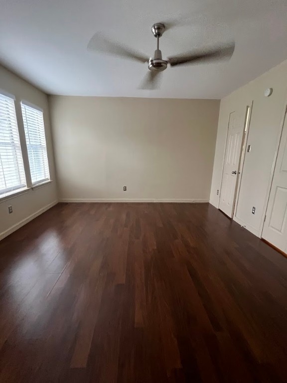 2529 Rio Grande Street, Unit 31 Austin, TX 78705 - Photo 18 of 21 an empty room with wooden floor fan and windows