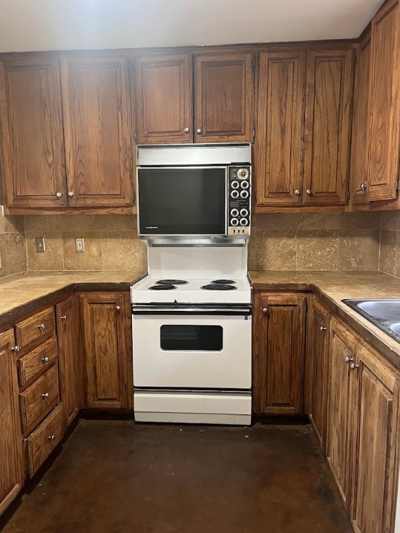 2529 Rio Grande Street, Unit 31 Austin, TX 78705 - Photo 6 of 21 a kitchen with granite countertop a stove and a sink