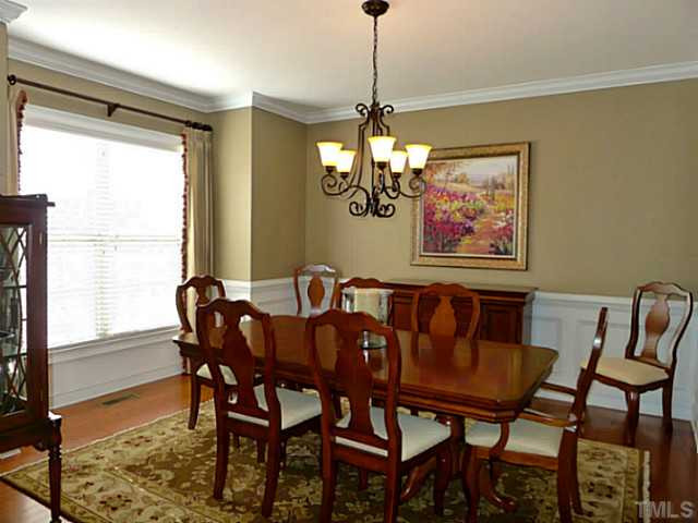 9811 Carvel Court Raleigh, NC 27613 - Photo 11 of 25 Dining room with beautiful mouldings and tons of space for holiday gatherings. Dining Room