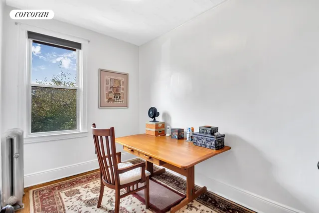 a view of a workspace with furniture
