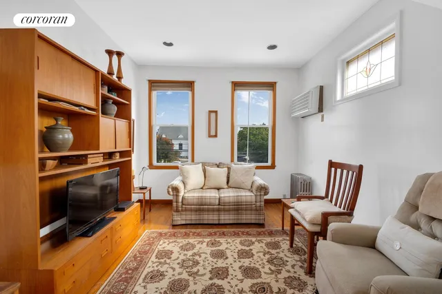 a living room with furniture fireplace and a flat screen tv