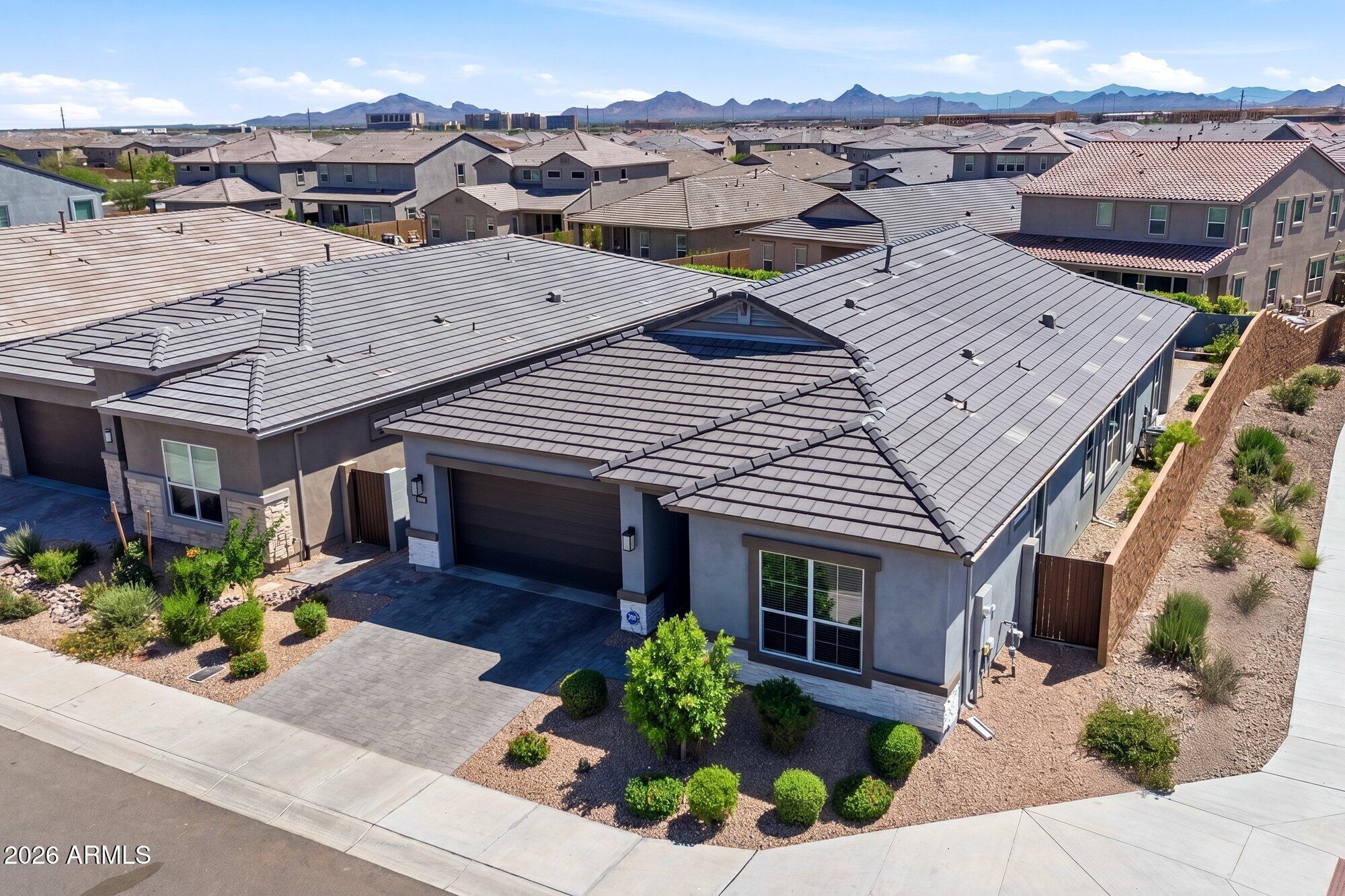 5963 East Lone Cactus Road Phoenix, AZ 85054 - Photo 1 of 22 an aerial view of a house with a yard and potted plants