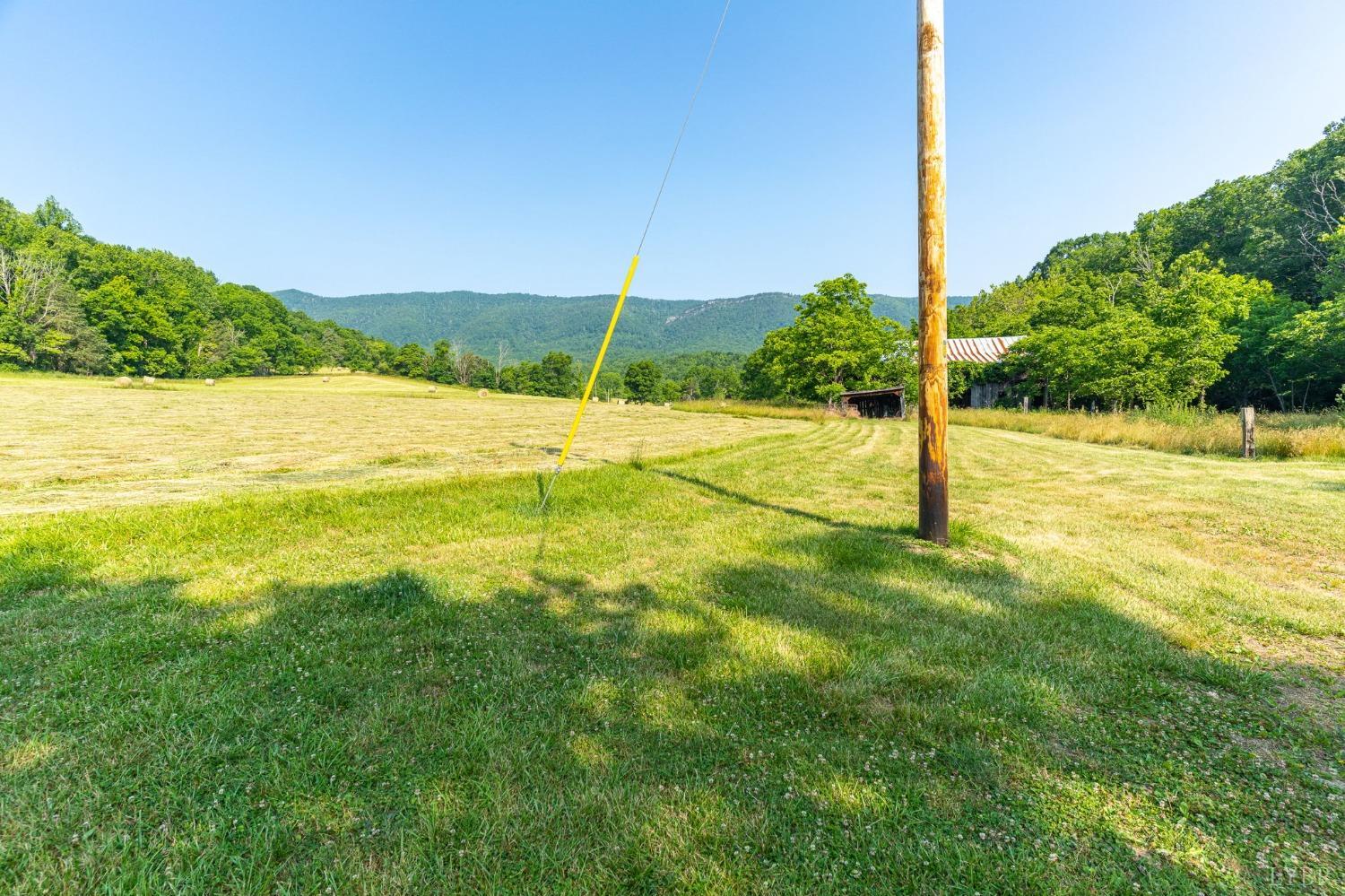 1095 Blacks Creek Road Lexington, VA 24450 - Photo 14 of 35 a view of a big yard with an ocean view