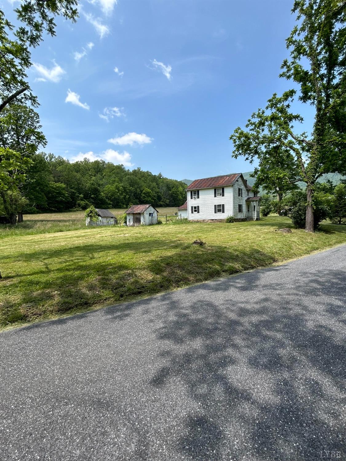 1095 Blacks Creek Road Lexington, VA 24450 - Photo 2 of 35 a view of a house with a big yard