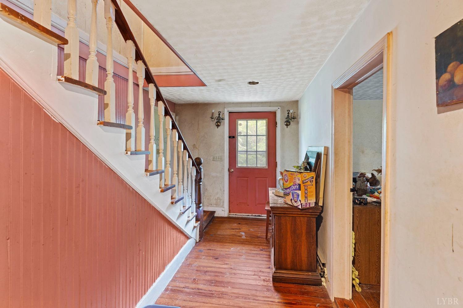 1095 Blacks Creek Road Lexington, VA 24450 - Photo 29 of 35 a view of a hallway with wooden floor and staircase