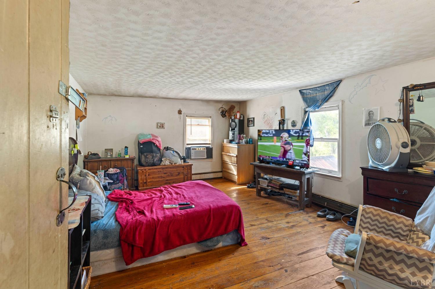 1095 Blacks Creek Road Lexington, VA 24450 - Photo 31 of 35 a living room with furniture and a wooden floor