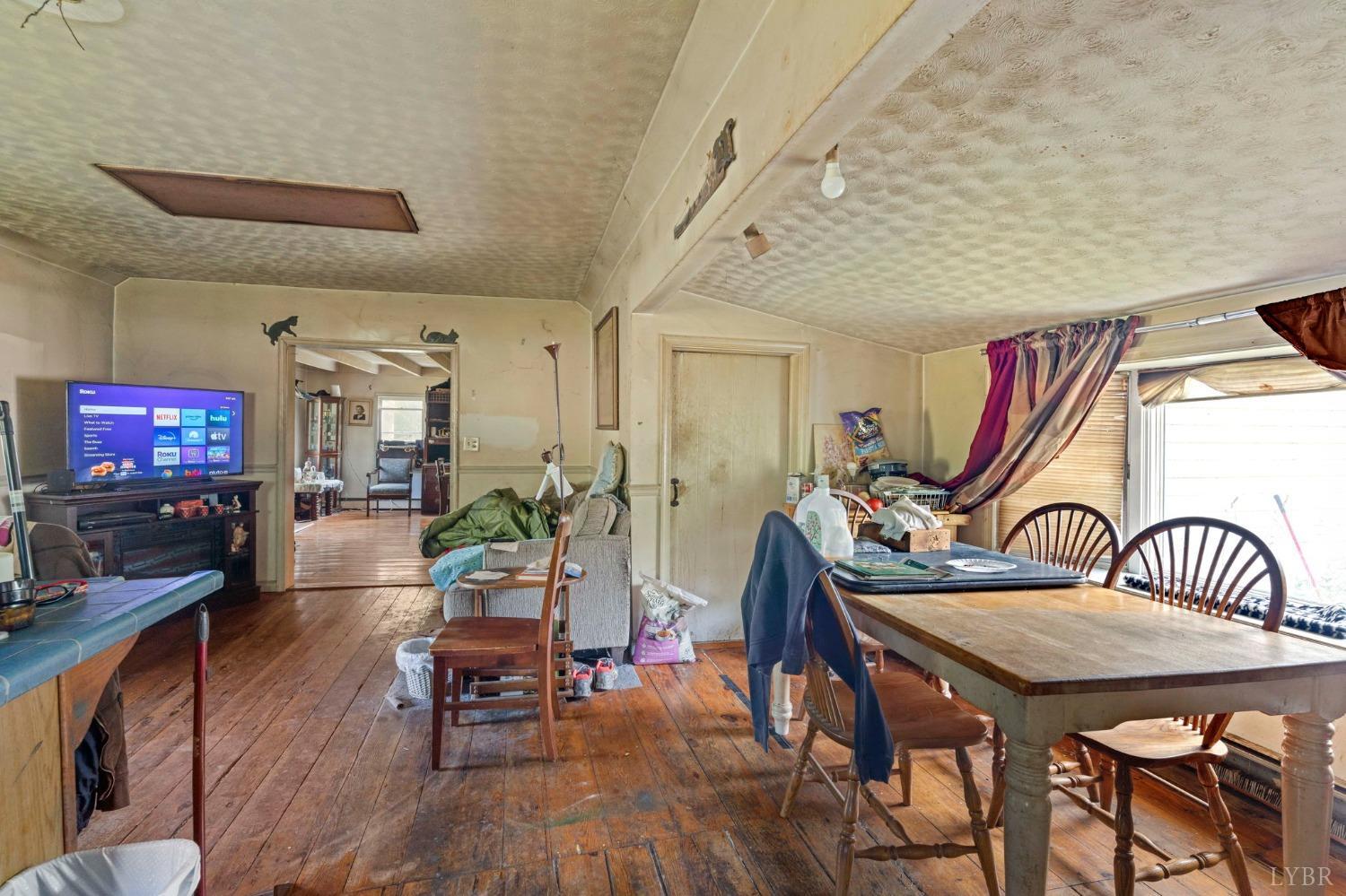 1095 Blacks Creek Road Lexington, VA 24450 - Photo 33 of 35 a living room with furniture and a flat screen tv
