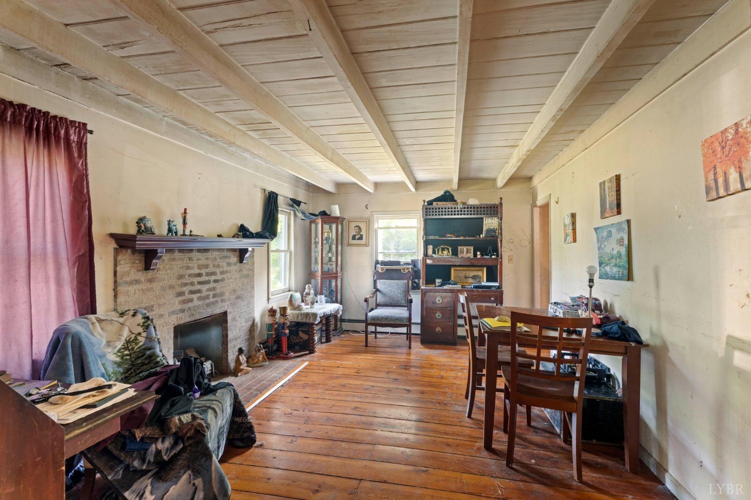1095 Blacks Creek Road Lexington, VA 24450 - Photo 34 of 35 a living room with furniture a fireplace and wooden floor