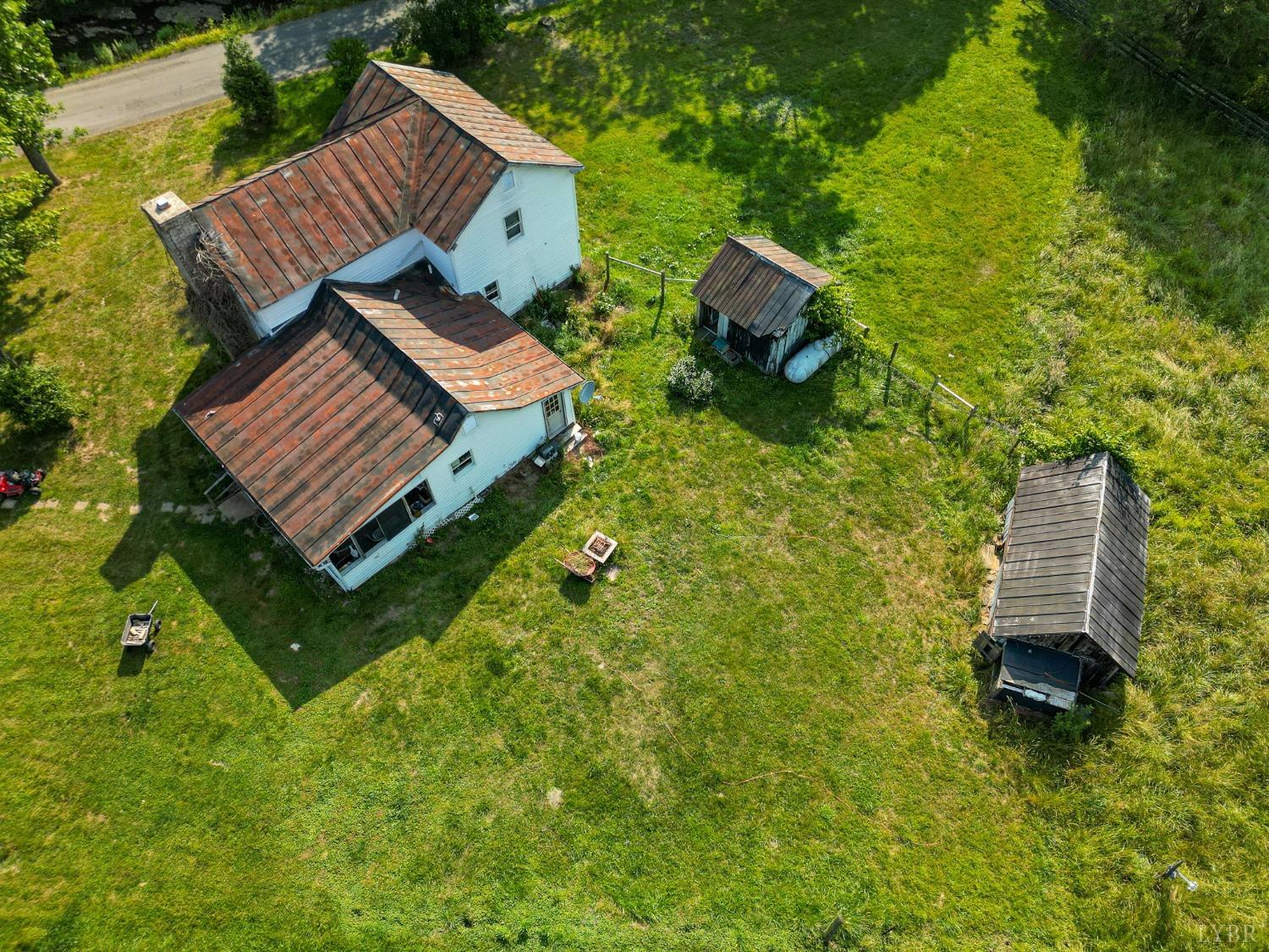 1095 Blacks Creek Road Lexington, VA 24450 - Photo 5 of 35 a view of an chairs in the backyard of a house