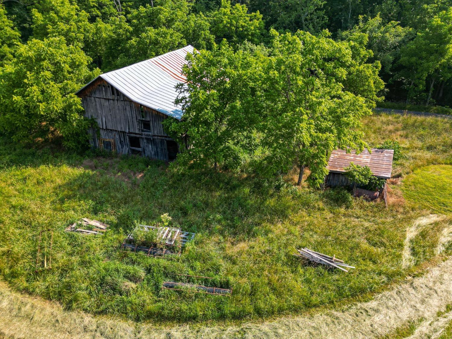 1095 Blacks Creek Road Lexington, VA 24450 - Photo 6 of 35 a aerial view of a house with swimming pool plants and large trees