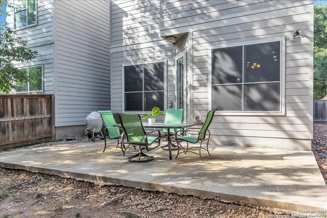 a view of a bench in a backyard