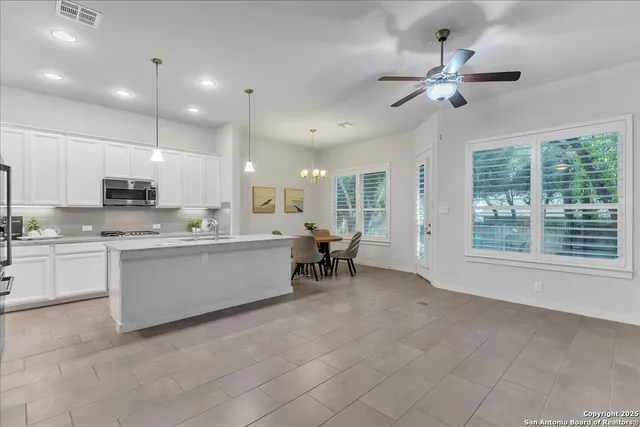 a view of a dining room with furniture and window