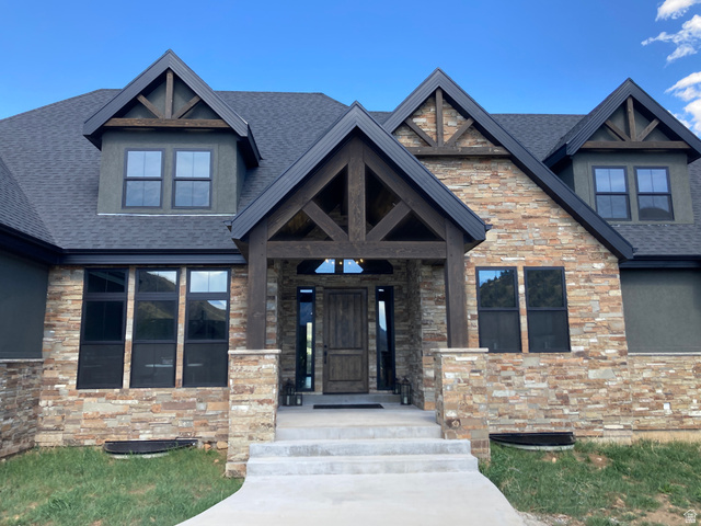259 Meadow Drive Springville, UT 84663 - Photo 2 of 62 Property entrance with stone siding, a porch, and roof with shingles