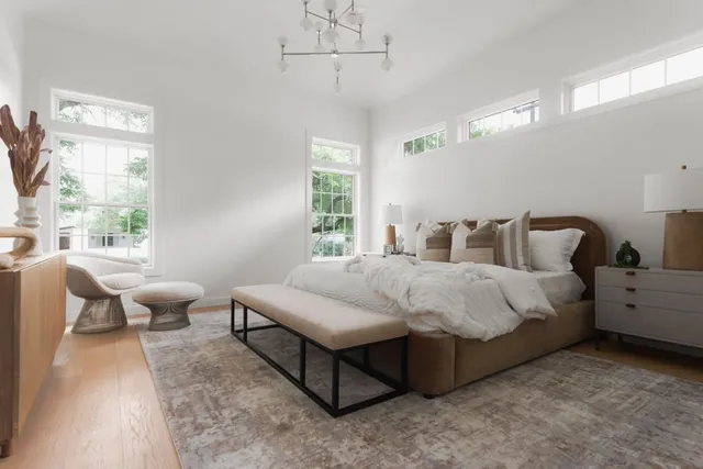 a bedroom with bed and window