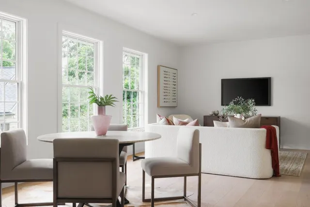 a dining room with furniture and window