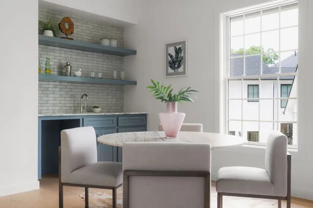a dining room with furniture and window