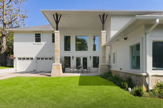 a front view of a house with garden