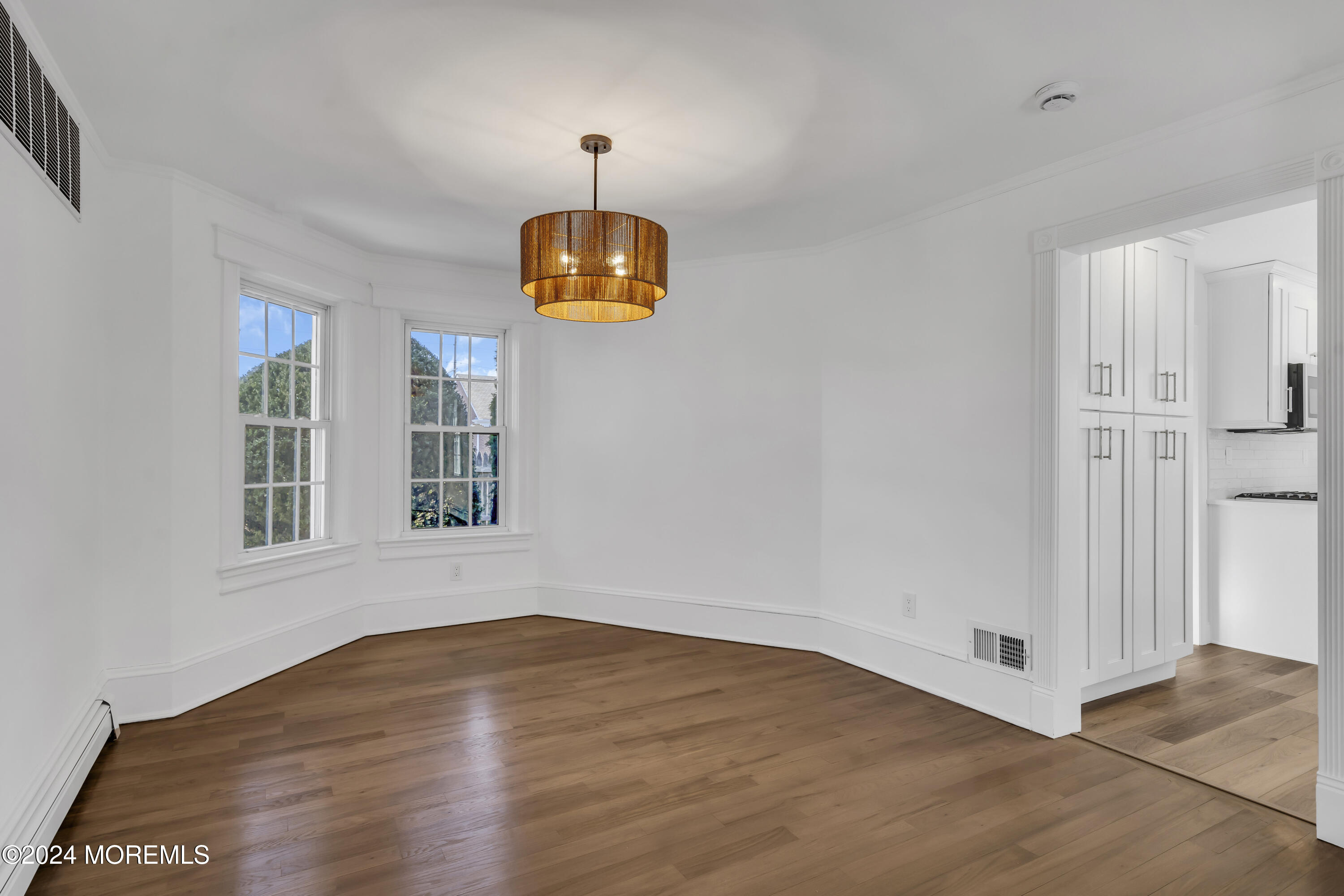 709 Prospect Avenue Spring Lake Heights, NJ 07762 - Photo 13 of 32 a view of empty room with wooden floor and fan