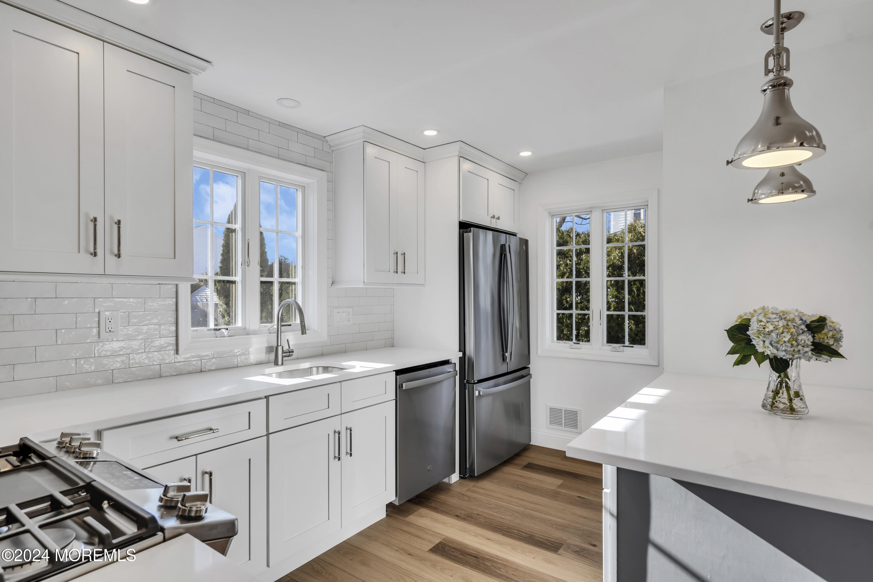 709 Prospect Avenue Spring Lake Heights, NJ 07762 - Photo 16 of 32 a kitchen with stainless steel appliances a sink stove and refrigerator