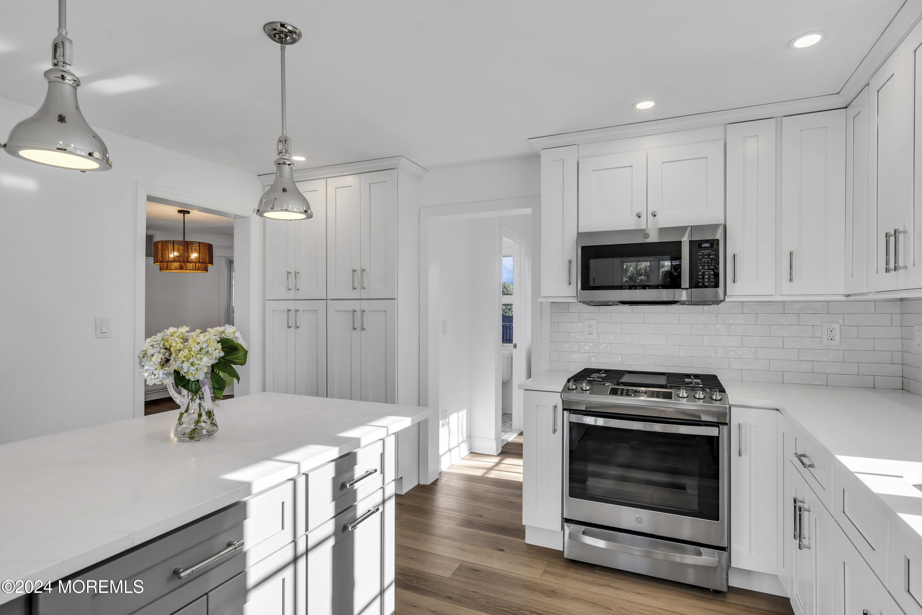 709 Prospect Avenue Spring Lake Heights, NJ 07762 - Photo 17 of 32 a kitchen with stainless steel appliances kitchen island granite countertop a stove a sink and a refrigerator