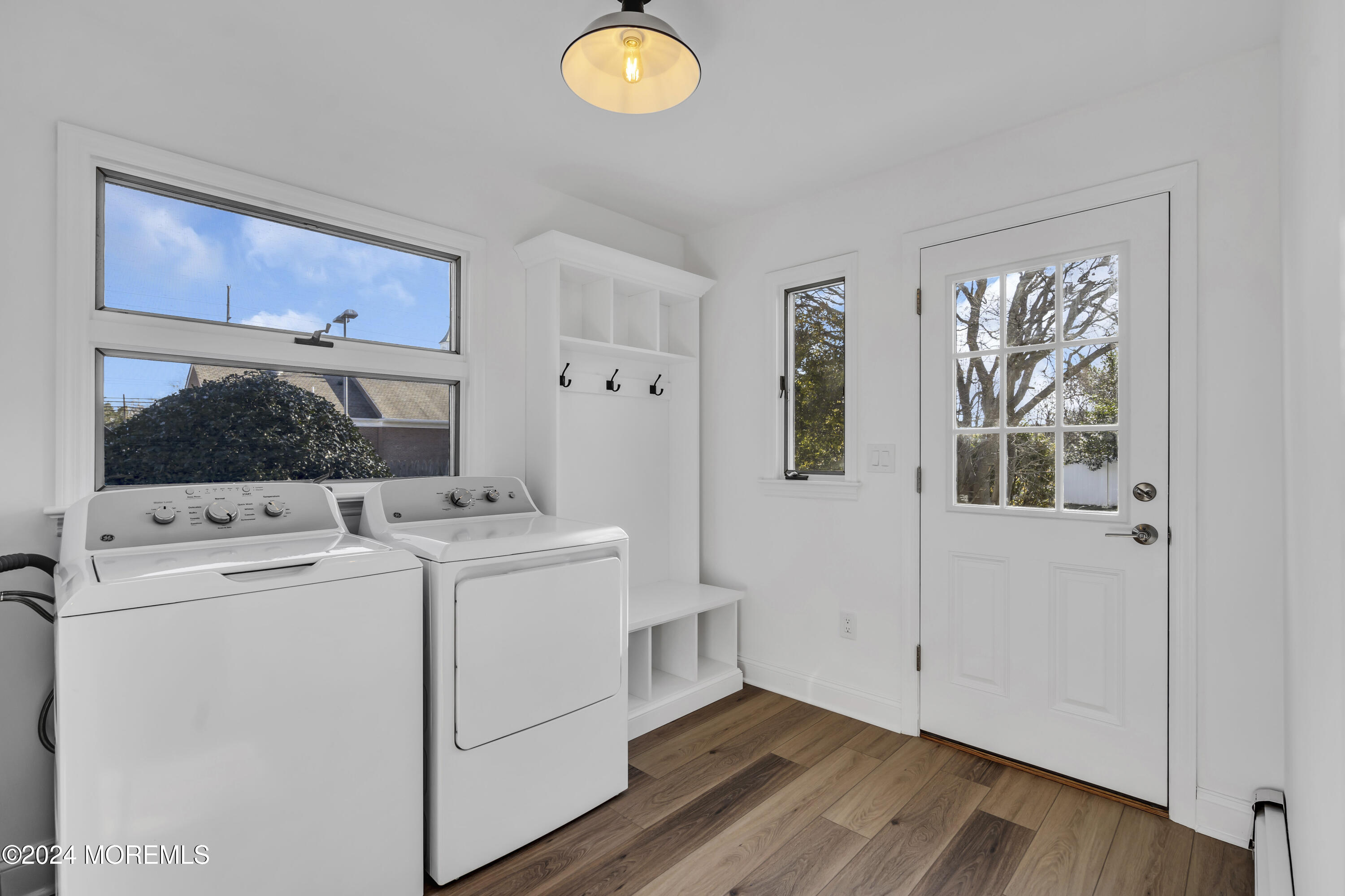 709 Prospect Avenue Spring Lake Heights, NJ 07762 - Photo 18 of 32 a view of washer and dryer with wooden floor