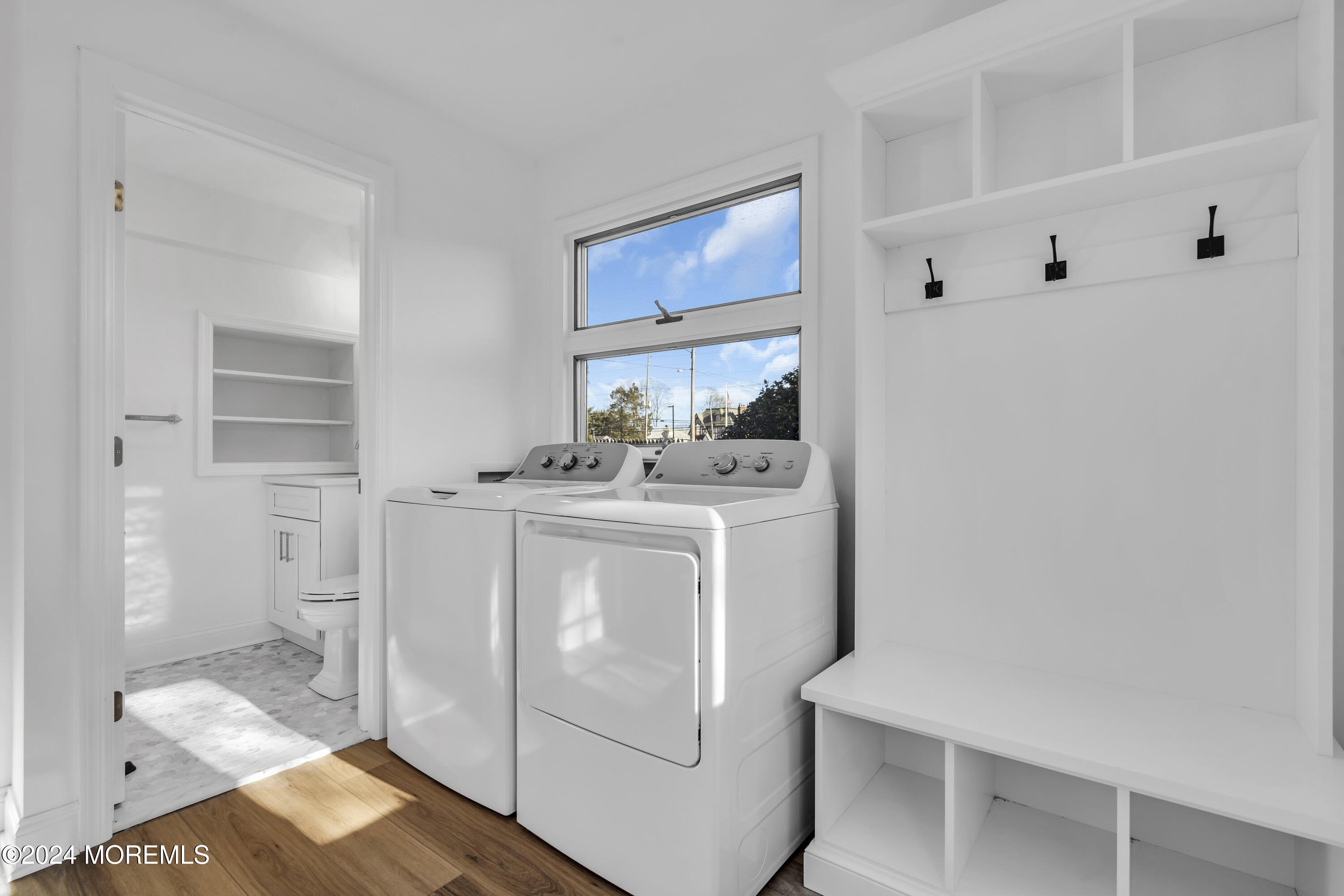 709 Prospect Avenue Spring Lake Heights, NJ 07762 - Photo 19 of 32 a utility room with cabinets washer and dryer