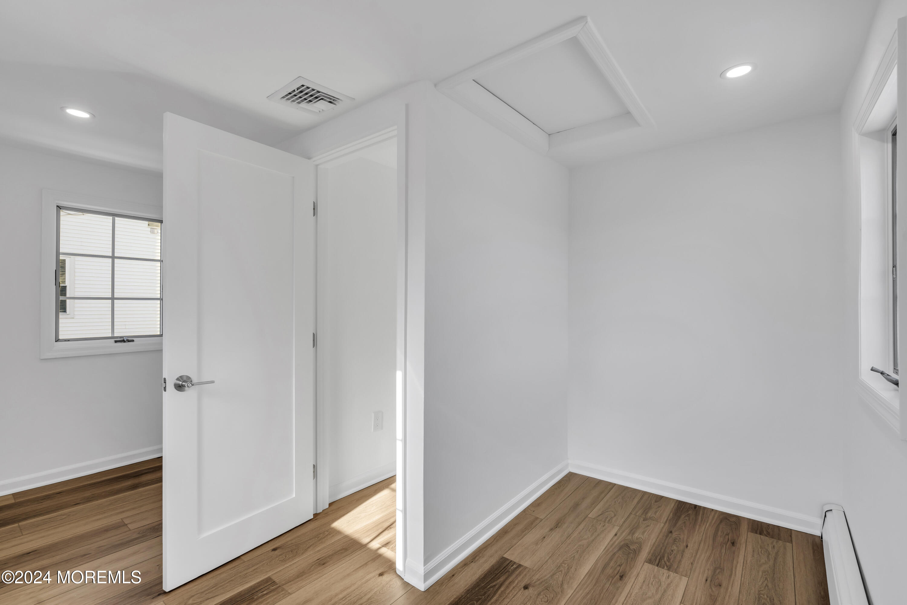 709 Prospect Avenue Spring Lake Heights, NJ 07762 - Photo 25 of 32 a view of empty room with wooden floor