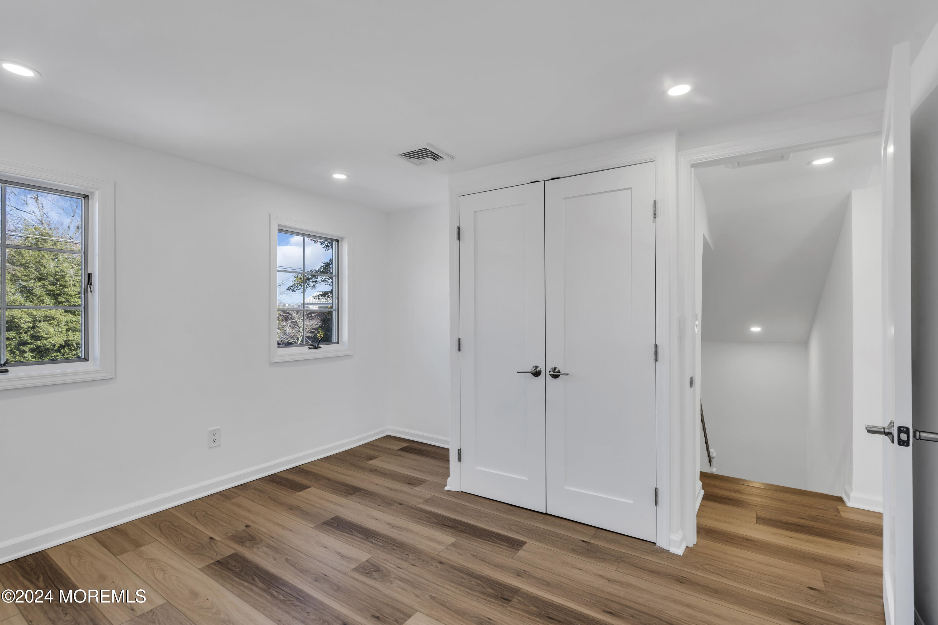 709 Prospect Avenue Spring Lake Heights, NJ 07762 - Photo 26 of 32 a view of room with window and wooden floor