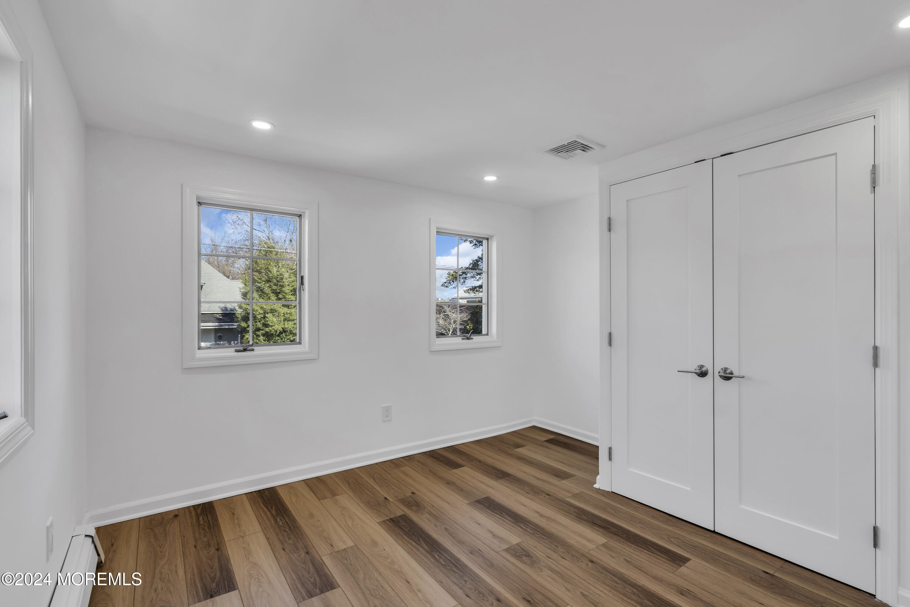 709 Prospect Avenue Spring Lake Heights, NJ 07762 - Photo 27 of 32 a view of room with window and wooden floor